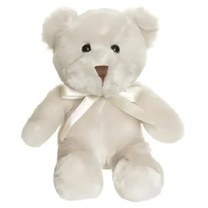 Vit liten nalle (ca 20 cm hög), med snälla svarta ögon. Vit rosett runt halsen.